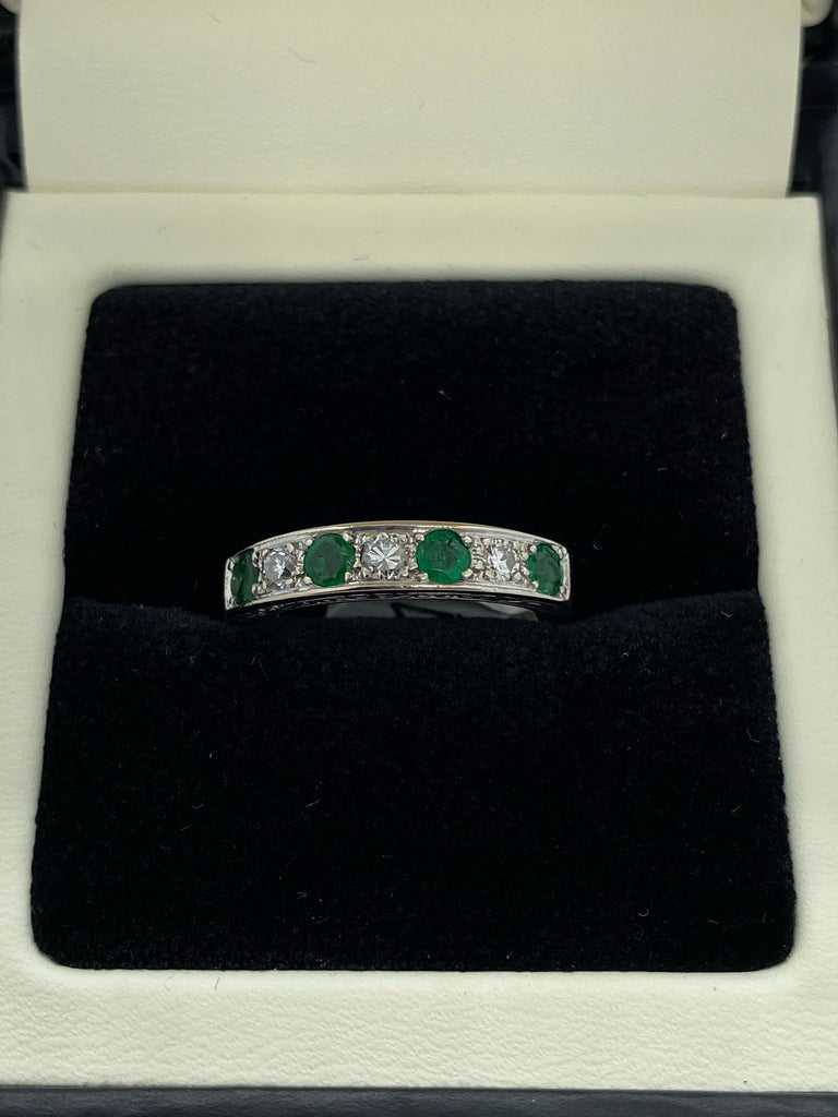 Seven stone emerald and diamond eternity ring 18ct white gold